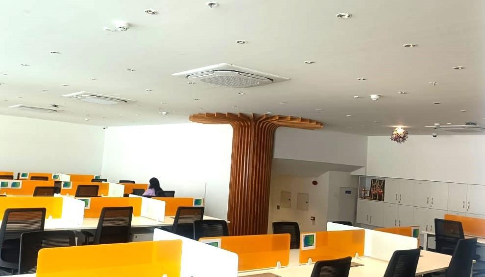 Chilled water cassette type indoor AC units installed in an open-plan office ceiling
