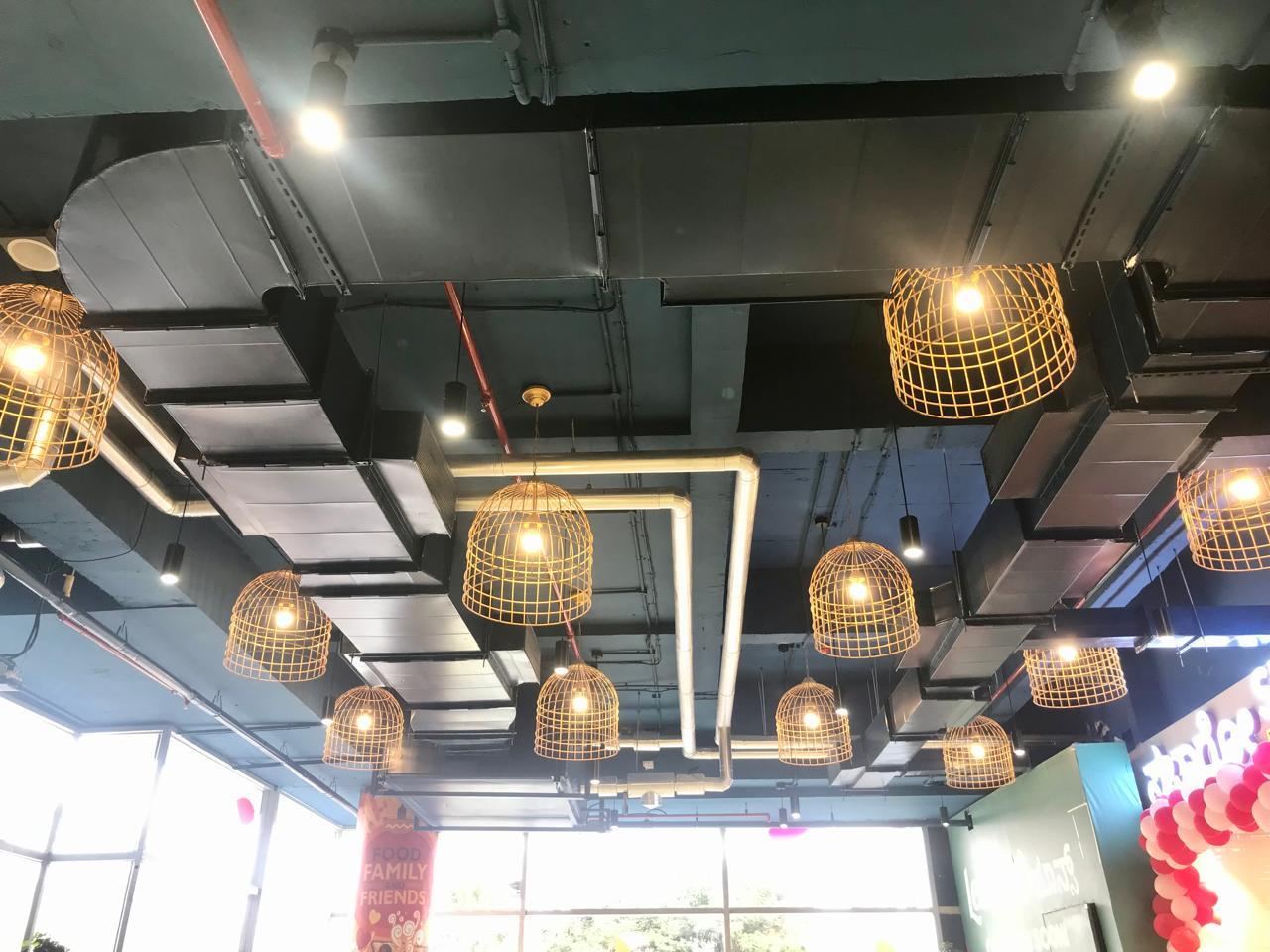 Ductwork and chilled water piping installed above a retail ceiling