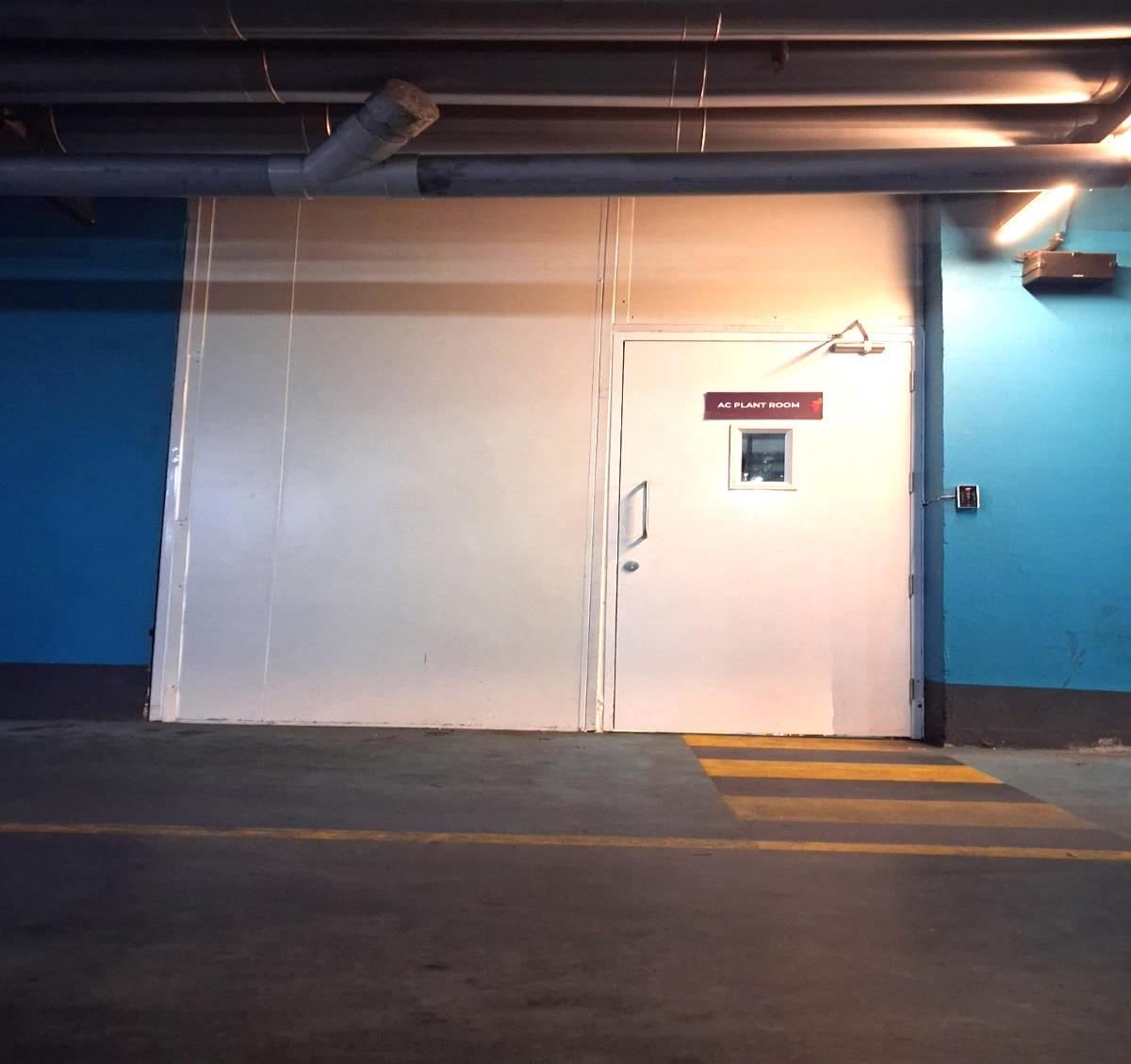Fire rated door and wall panel installed in an AC plant room