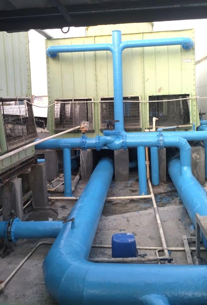 FRP coated condenser water piping connected to rooftop cooling towers